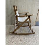 A VINTAGE CHILDS ROCKING CHAIR