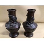 A PAIR OF ORIENTAL BRONZE VASES DECORATED WITH BIRDS, 20CM