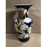 VIETNAMESE LARGE CERAMIC BALUSTER SHAPED VASE DECORATED WITH A DRAGON ON BLUE BACKGROUND, 51CM