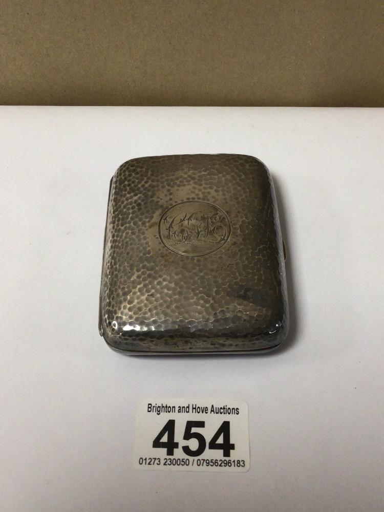 A HALLMARKED SILVER BEATEN CIGARETTE CASE, 99G