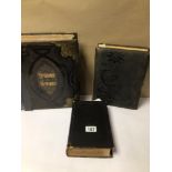 TWO VINTAGE HOLY BIBLES, ONE BRASS BOUND, TOGETHER WITH A VICTORIAN EMPTY PHOTO ALBUM, TWO A/F