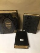 TWO VINTAGE HOLY BIBLES, ONE BRASS BOUND, TOGETHER WITH A VICTORIAN EMPTY PHOTO ALBUM, TWO A/F