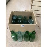 A VINTAGE COLLECTION OF GREEN GLASS BOTTLES