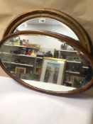 TWO BEVELLED EDGE WALL MIRRORS IN OVAL FORM, THE LARGEST BEING 66CM IN HEIGHT