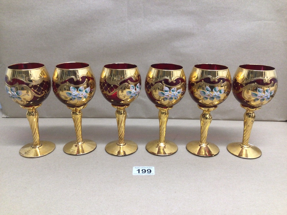 A SET OF SIX MURANO STYLED RUBY RED GILDED AND ENAMELED WINE GLASSES