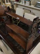 A MAHOGANY THREE TIER SHELF UNIT WITH FRETWORK SIDES