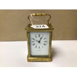 BRASS CARRIAGE CLOCK WITH ENAMEL DIAL INSCRIBED 'THE EQUATOR' WORKING ORDER WITH KEY