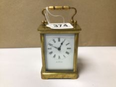 BRASS CARRIAGE CLOCK WITH ENAMEL DIAL INSCRIBED 'THE EQUATOR' WORKING ORDER WITH KEY