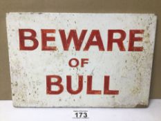 A BEWARE OF BULL WOODEN SIGN