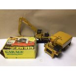 TWO CAT CONSTRUCTION DIE-CAST MODEL VEHICLES WITH A BOXED GARAGE, A KLEIN K-2000 WATER TANK, AND A