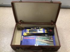 A VINTAGE BROWN/TAN TRAVEL CASE WITH A LONE STAR TRAIN SET A/F (CONTENTS UNCHECKED)