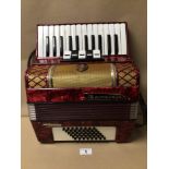 A BARCAROLE STUDIOSUS ACCORDION IN CLASSIC RED, UNTESTED