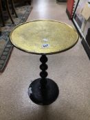 BRASS TOP ROUND SIDE TABLE ON A CAST BASE 39 X 57CM
