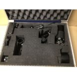 AN ALUMINIUM HARD CASE OF CAMERA ACCESSORIES, INCLUDES LENSES, FILM, AND MORE