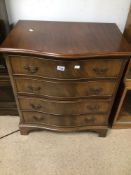 A MAHOGANY REPRODUCTION SERPENTINE CHEST OF FOUR DRAWERS