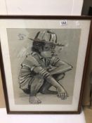 AN INDISTINCTLY SIGNED FRAMED AND GLAZED CHALK AND PENCIL DRAWING DEPICTING A BOY SMOKING, 57CM X