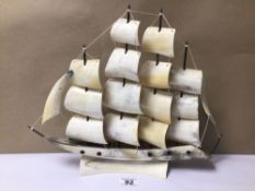 A MODEL SHIP ON STAND MADE OF HORN, 43CM X 35CM