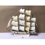 A MODEL SHIP ON STAND MADE OF HORN, 43CM X 35CM