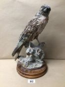 A SIGNED ‘G. ARMANI’ CAPODIMONTE STYLED PORCELAIN FIGURE OF A HAWK/FALCON ON A WOODEN BASE, 35CM