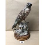 A SIGNED ‘G. ARMANI’ CAPODIMONTE STYLED PORCELAIN FIGURE OF A HAWK/FALCON ON A WOODEN BASE, 35CM