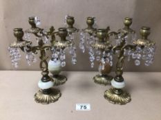 TWO PAIRS OF TWIN BRANCHED BRASS/ONYX CANDLESTICKS WITH CUT GLASS DROPLETS