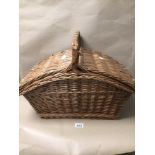 SLOPE SIDED CANE HAMPER BASKET, WITH HANDLE AND PLATES, BOWLS, AND CUPS