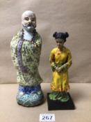 A CHINESE GLAZED FIGURE WITH A RESIN FIGURE, THE LARGEST 27CM