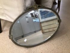 DECORATIVE METAL-FRAMED BEVELLED EDGED OVAL WALL MIRROR, BEING 60CM X 40CM