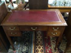 A LADIES WRITING DESK WITH RED LEATHER TOP WITH ORIGINAL CASTORS