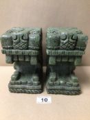 A PAIR OF COLOMBIAN STYLED STONE BOOKENDS