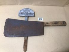A BUTCHER'S CLEAVER AND A METAL 1937 PLANTING MARKER