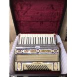 CASED ANTORIA-LUDWIG ‘POPULAR’ ACCORDION, WITH INLAID FAUX MOTHER OF PEARL