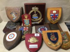 BOX OF WOODEN AND CAST IRON WALL PLAQUES OF MOSTLY MILITARY COAT OF ARMS