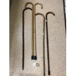 FIVE MIXED WOODEN WALKING STICKS INCLUDES SILVER BAND