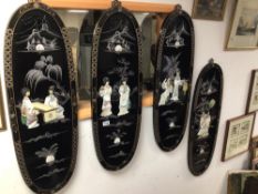 FOUR BLACK LACQUERED CHINOISERIE OVAL PANELS DECORATED WITH MOTHER OF PEARL, 94 X 30CM