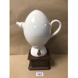 A VIKTOR SCHAUBERGER DESIGN EGG-SHAPED PORCELAIN WATER JUG, ON STAND