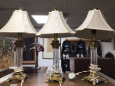 A PAIR OF BRASS AND GLASS COLUMN LAMPS, 56CM