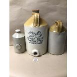 THREE STONEWARE/EARTHENWARE FLAGONS, ONE LABELLED ‘PINK’S GINGER BEER CHICHESTER AND BOGNOR’,