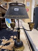 AN EARLY BLACK AND GOLD TOLEWARE METAL PIANO LAMP