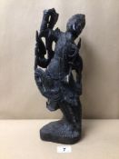 AN EBONISED CARVED WOODEN INDONESIAN FIGURINE, A/F, BEING 38CM IN HEIGHT