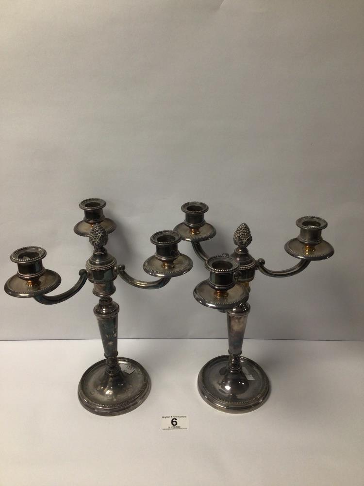 A PAIR OF HEAVY WEIGHTED THREE BRANCH CANDELABRAS IN SILVER PLATE, 27CM
