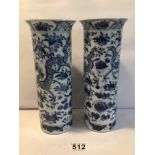 A PAIR OF CHINESE KANGXI BLUE AND WHITE SPILL VASES WITH SCROLLING DRAGONS AMIDST FLOWERING BLOOMS