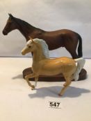 TWO ROYAL DOULTON HORSES, ONE ON MAHOGANY BASE, THE LARGEST 27CM