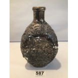 A VINTAGE DIMPLE BOTTLE DECORATED IN WHITE METAL FILAGREE