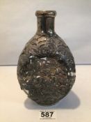 A VINTAGE DIMPLE BOTTLE DECORATED IN WHITE METAL FILAGREE