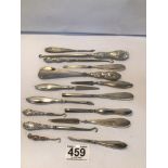 A QUANTITY OF SILVER HANDLED, BUTTON HOOKS, SHOE HORNS AND MORE