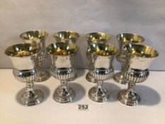 EIGHT SILVER ON COPPER GOBLETS