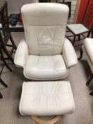 EKORNES CREAM LEATHER SWIVEL ARMCHAIR AND MATCHING FOOT STOOL