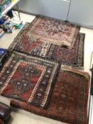 A QUANTITY OF VINTAGE RUGS