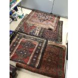 A QUANTITY OF VINTAGE RUGS